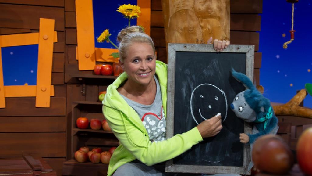 Schlechte Laune mag Fidi gar nicht. Da malt Singa ganz schnell wieder ein Lächel-Gesicht und sie singen gemeinsam das Lächel-Lied.