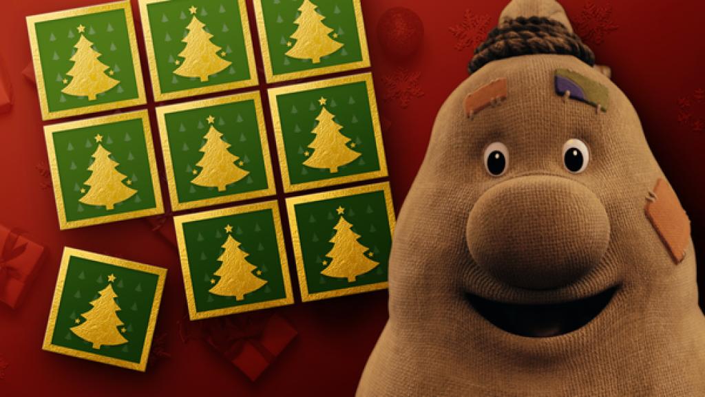Beutolomäus steht vor einen Hintergrund mit Weihnachtsspielkarten