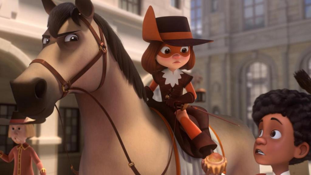 D'Artagnan sitzt auf ihrem Pferd und schaut gebannt zu Alex, der mit erschrockenem Blick neben ihr steht. Er hält eine Brioche in seiner rechten Hand. Im Hintergrund läuft ein Spaziergänger vor Häusern.