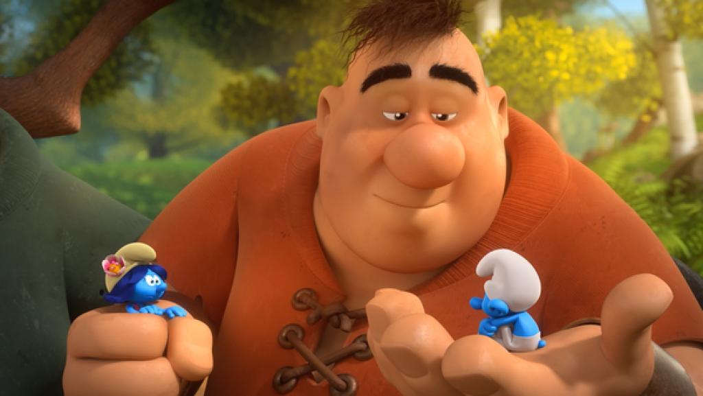 Der Riese Großmaul hat Schüchti und Blüte gefangen. Schüchti sitzt auf seiner großen Handfläche.