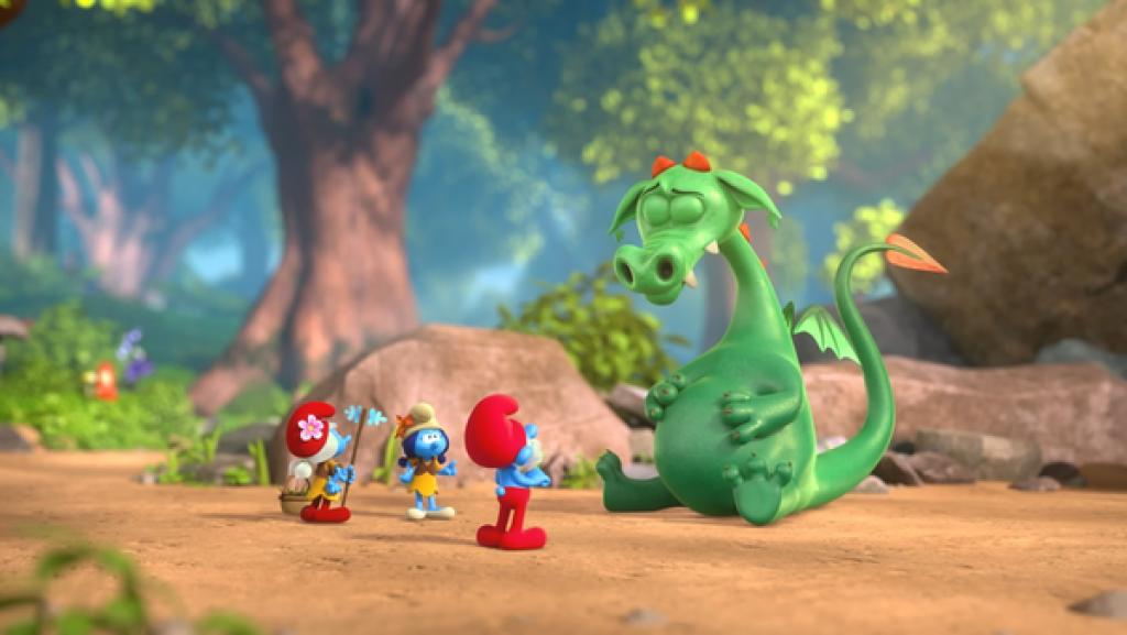 Ein Drache sitzt mit gesenktem Kopf vor Papa Schlumpf. Er hat Schlumpf Schlappi verschluckt.