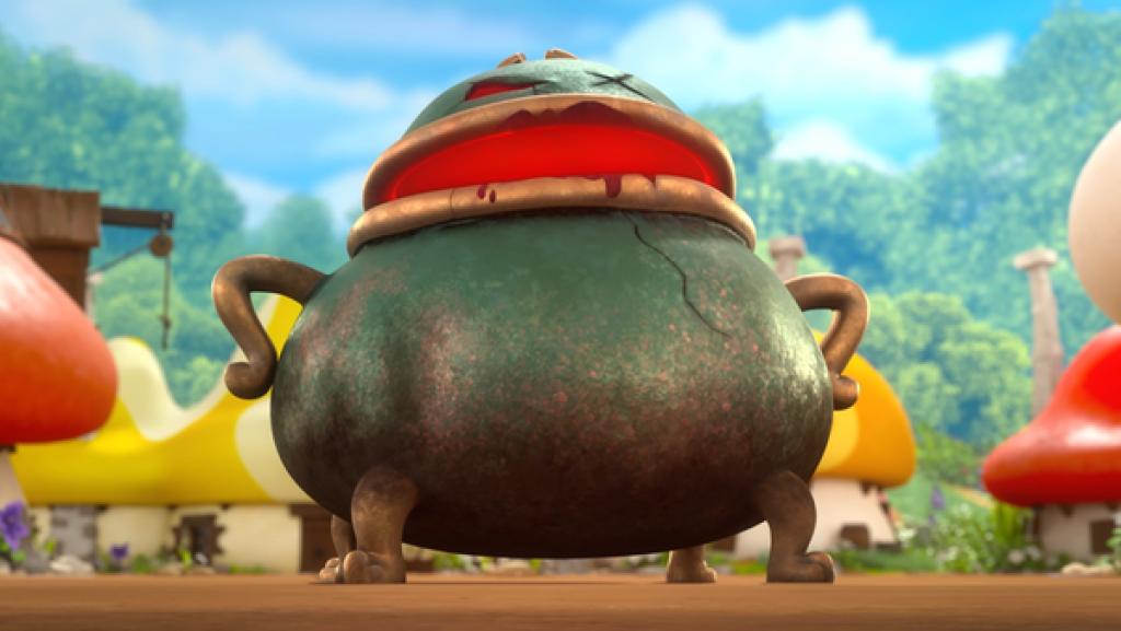 Ein Zauberkessel mit Augen und aufgeklapptem Mund steht den Schlümpfen gegenüber.