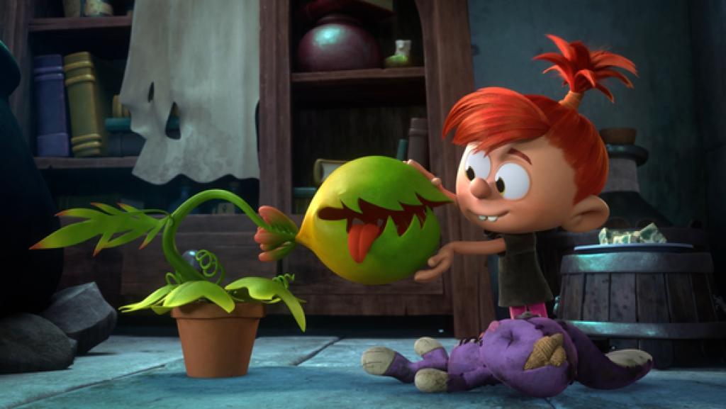 Das kleine Mädchen Rowena streichelt ihre fleischfressende Pflanze. Sie heißt Gulp.