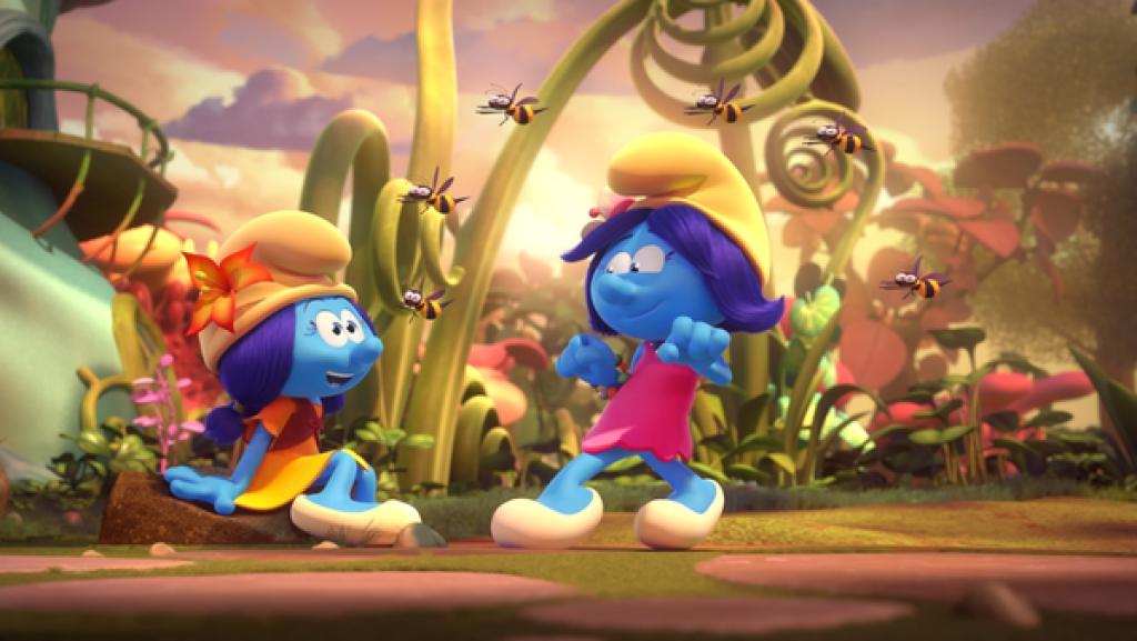 Blüte tanzt im pinken Kleid und wird von sechs Bienen umschwärmt. Lily schaut begeistert zu.