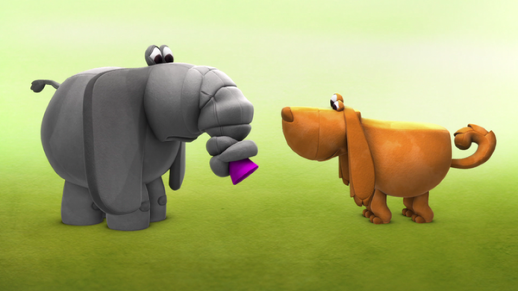 Der Elefant hat einen verstopften Rüssel und vor ohm steht ein Hund