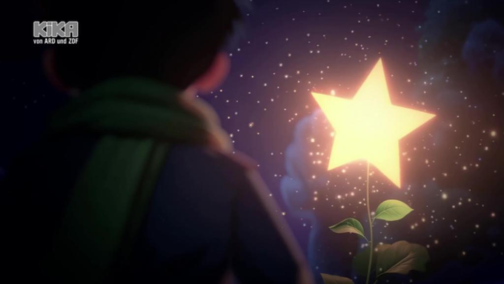 Ein Junge ist von hinten zu sehen. Er blickt auf einen leuchtenden gelben Stern.